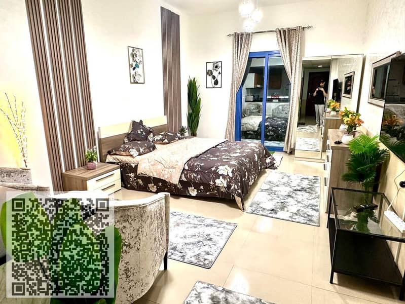 Studio apartment for sale in Al Nuaimiya Towers with parking and a view of Sheikh Khalifa Street.