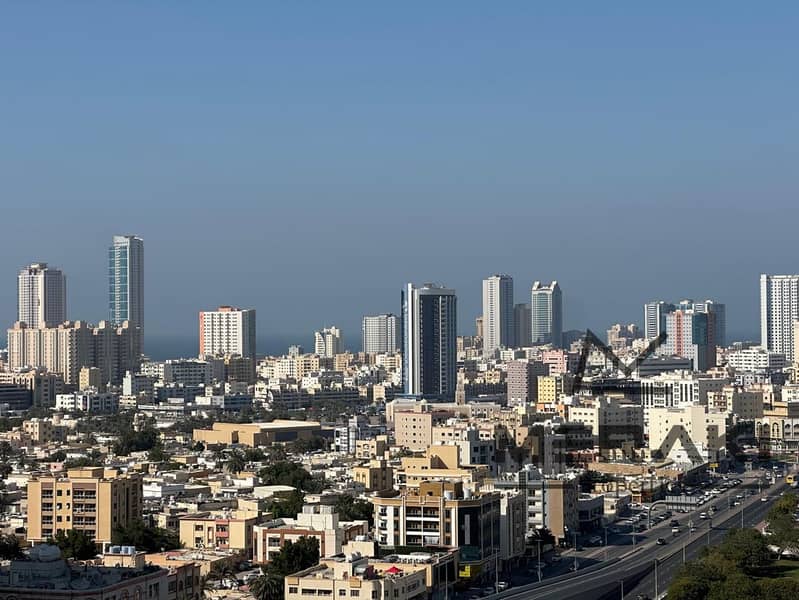 For sale in City Tower Ajman, a one-bedroom apartment with a living room, area 940 square feet, open view