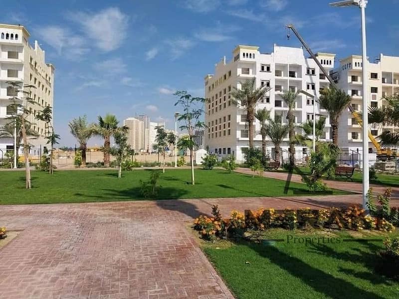 The lowest price for a one-bedroom apartment with a living room in Amira Village, in an amazing location on Mohammed bin Zayed Road, ready to move