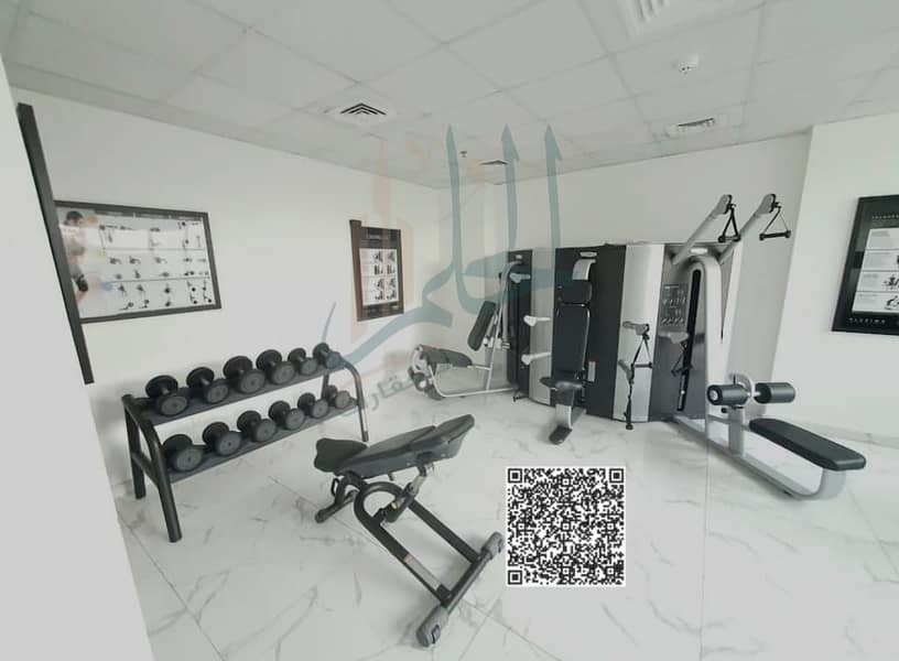 For sale: Furnished apartment with two rooms and a lounge ready to own in installments in Al Waha Towers - Ajman
