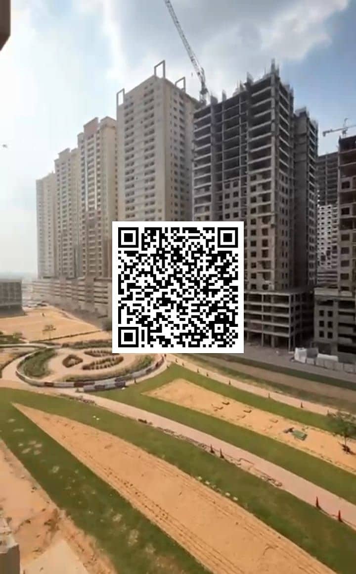 Luxurious two-bedroom apartment with living room for sale, featuring open views and parking in Paradise B6 – Emirates City, Ajman