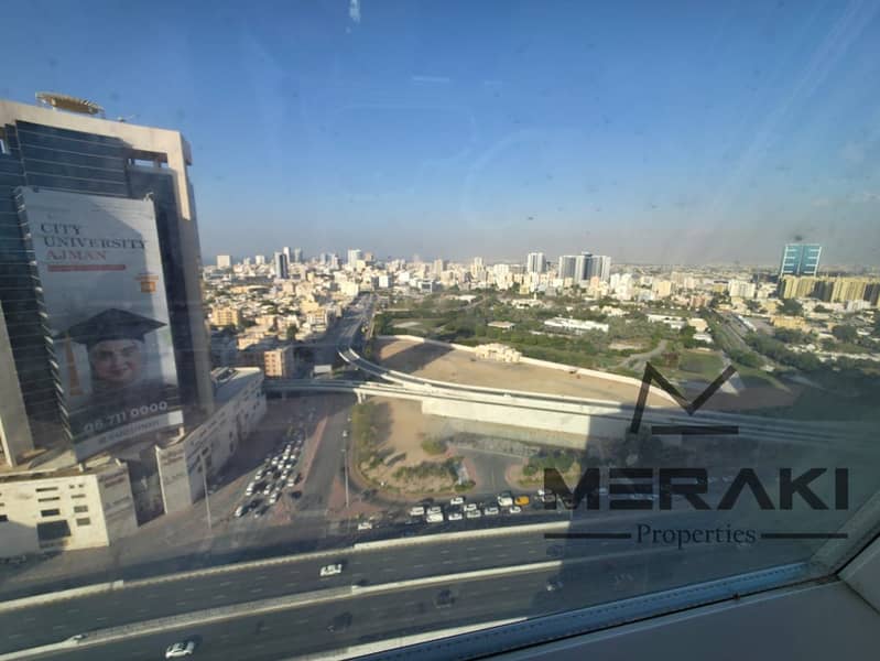 1BHK apartment with a living room for sale with a fully open view of the palace in City Tower in the heart of Ajman at a bargain price with parking.