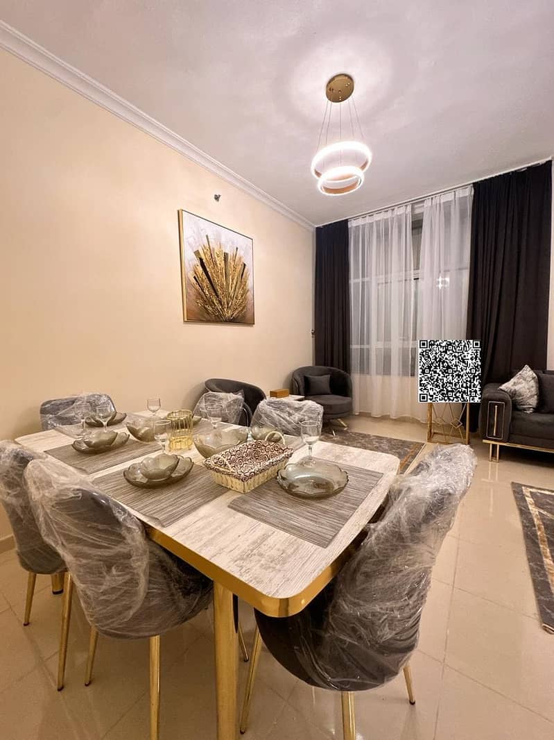 Two bedrooms and a living room with a balcony, parking, and furnishings